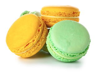 Tasty macarons on white background