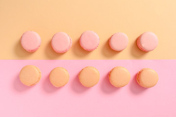 Tasty macarons on color background