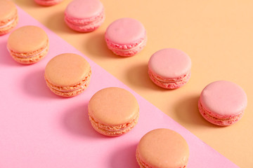 Fototapeta na wymiar Tasty macarons on color background
