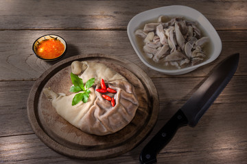 Pork stomach with cutting board and knife
