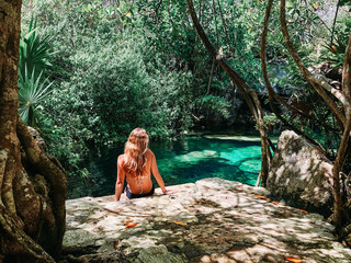 Fototapeta na wymiar Women relax in cenote