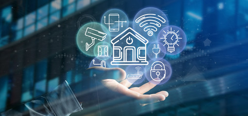Businessman holding Smart home interface with icon, stats and data 3d rendering