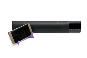 cellphone and  black bluetooth speaker isolated on white background