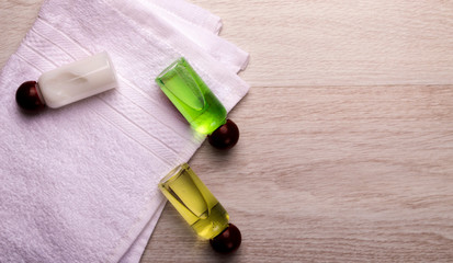 hotel accessories kit on a white towel, on a light background.