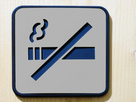 No smoking gray square sign on wooden background