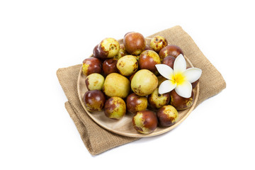 Chinese jujube on wood plate, isolated on white background
