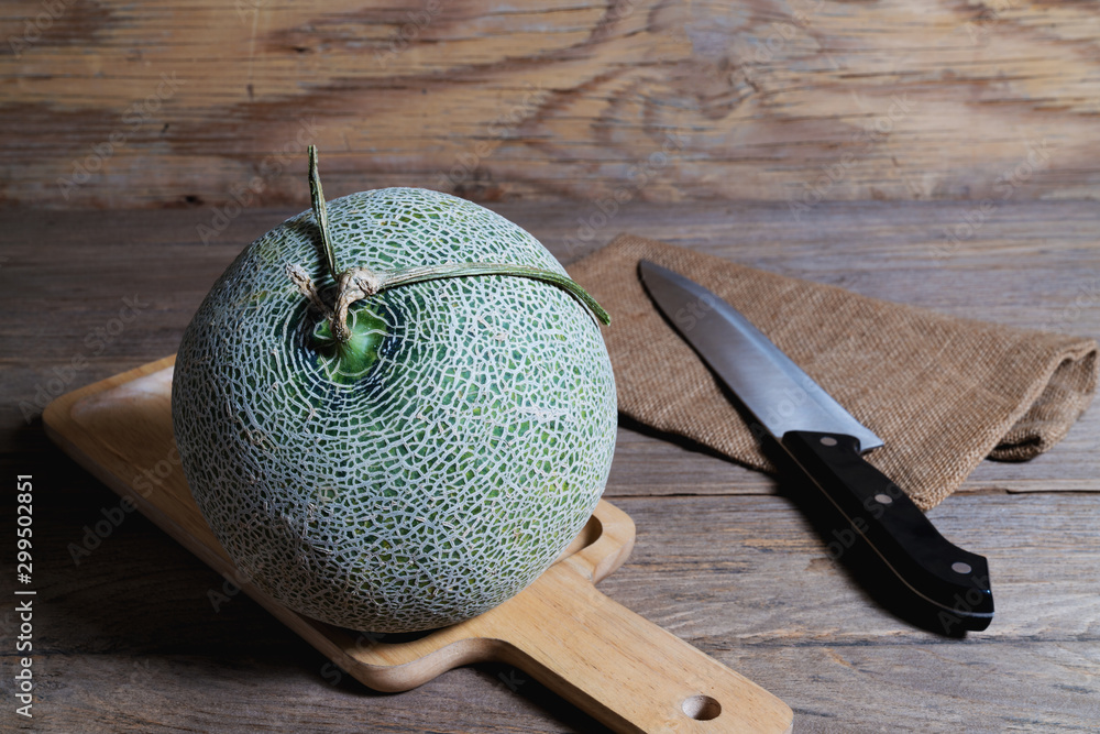 Canvas Prints melon and knife on cutting board