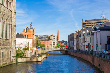 Ghent Reep, a small canal with a bridge and houses in both sides. Wall of Castle of Gerald the Devil on the left