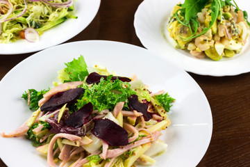 different salads in a plate on the table