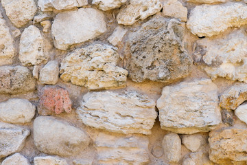 Texture of a antique stone wall. Old castle stone wall texture background. Stone wall as a background or texture.