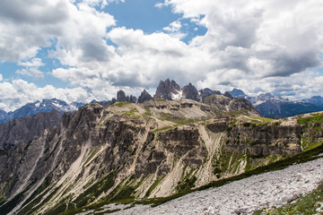 Fototapeta na wymiar Dolomites, Italy - July, 2019: Amazing panoramic view from Tre Cime over the Dolomite's mountain chain