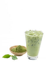 Isolate Iced Green Tea latte matcha on white background with crushed tea extract powder in wooden cup and leaves. The most popular beverage drinks in the world from Japanese.