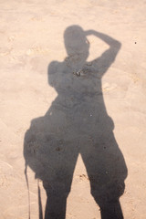 silhouette photographer on sand beach