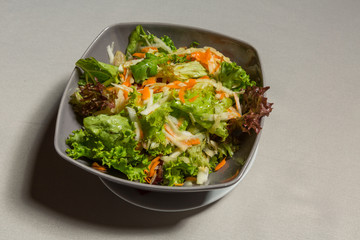 Mixed green salad in a bowl