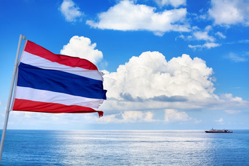 The Kingdom of Thailand flag, sea, sky, clouds and ship beautiful background, flag on pole waving on wind, state independence symbol, Thai national sign, red, white, blue color stripes banner close up