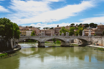 Fototapeta na wymiar Bridge crossing in Tevere river in Rome Italy