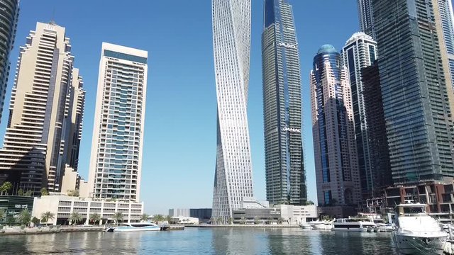 Dubai marina with famous landmark buildings twisting tower and most luxury marina.