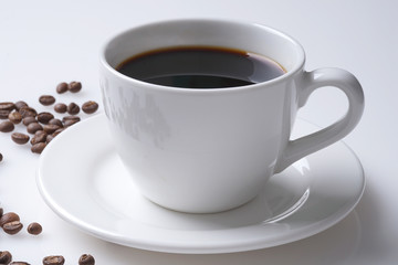 cup of coffee and coffee beans with space