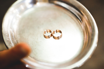 Wedding rings on ceremony at church. Macro.
