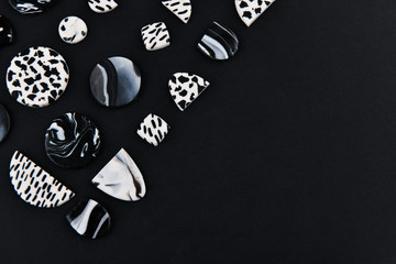 A product from polymer clay. Black and white polymer clay. Hand sculpting, product for earrings on...