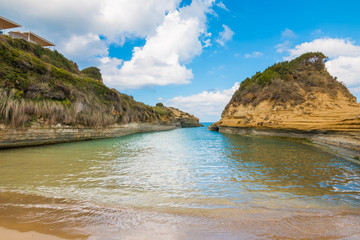 Fototapeta na wymiar Colorful spring view of famous Channel Of Love (Canal d'Amour) beach. Bright morning seascape of Ionian Sea. Amazing outdoor scene of Corfu Island, Greece, Europe. Beauty of nature concept background