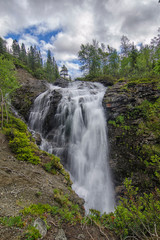 Fototapeta na wymiar Waterfall on Risjok river in Khibiny Mountains, Kola Peninsula, Russia