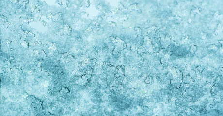 Fototapeta na wymiar Frozen water. Snowflakes sparkling in the sun