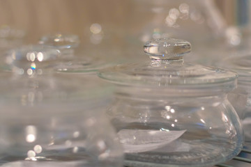 Glass pots with lids close up, selective focus