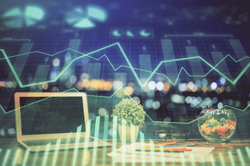 Forex graph hologram on table with computer background. Double exposure. Concept of financial markets.