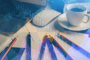 Financial chart drawing and table with computer on background. Double exposure. Concept of international markets.