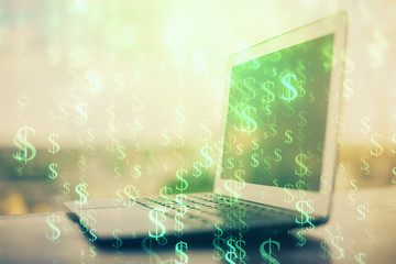 Stock market graph on background with desk and personal computer. Double exposure. Concept of financial analysis.