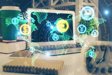 Financial chart drawing and table with computer on background. Double exposure. Concept of international markets.