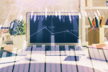 Naklejka premium Financial market graph hologram and personal computer on background. Multi exposure. Concept of forex.