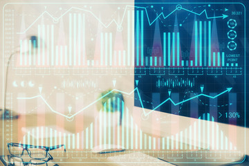 Financial market graph hologram and personal computer on background. Double exposure. Concept of forex.