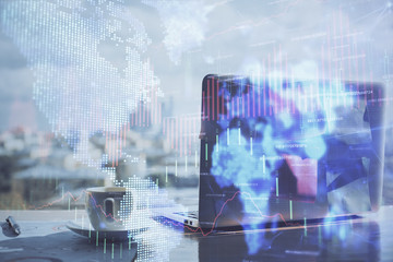 Stock market graph and table with computer background. Multi exposure. Concept of financial analysis.