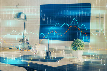 Financial graph colorful drawing and table with computer on background. Multi exposure. Concept of international markets.