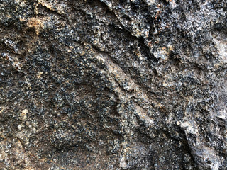 Granite texture - design lines gray seamless stone abstract surface grain rock background construction closeup details.