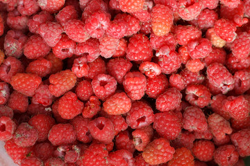 a natural texture of ripe garden raspberries