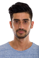 Studio shot of face of young Persian man