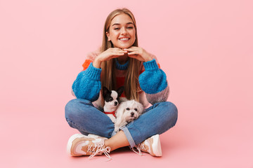 Cute lovely girl wearing sweater sitting with legs crossed