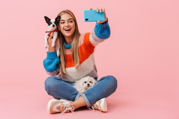 Cute lovely girl wearing sweater sitting with legs crossed