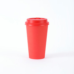 Red paper cup of coffee or tea on a white background. Mock up. Front view mockup of empty polystyrene coffee mug. Take away.