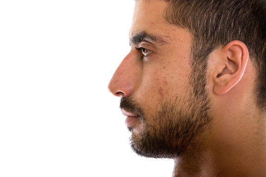Close up profile view of young Persian man