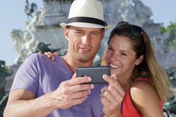 couple of tourists on vacation taking selfie picture