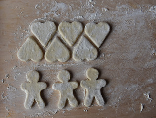 making Christmas cookies from dough