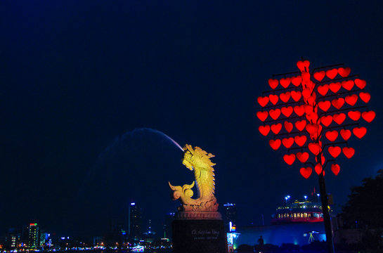 Statue of Carp Becoming a Dragon in DHC Marina of Da Nang, Vietnam, at night 