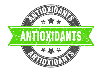 antioxidants round stamp with green ribbon. antioxidants