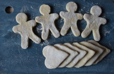 making Christmas cookies from dough