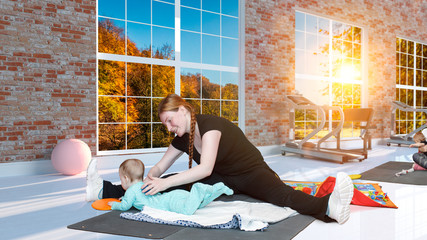 Kangatraining classes - young mothers with children in the gym