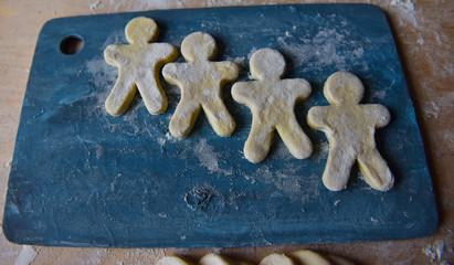 making Christmas cookies from dough